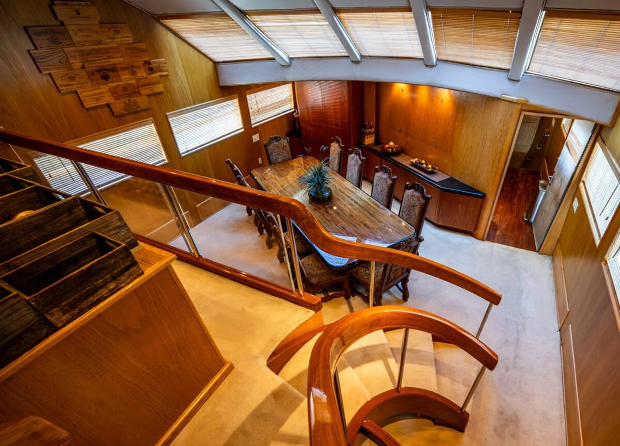 a large room with a piano and chairs aboard LE MONTRACHET Yacht for Sale