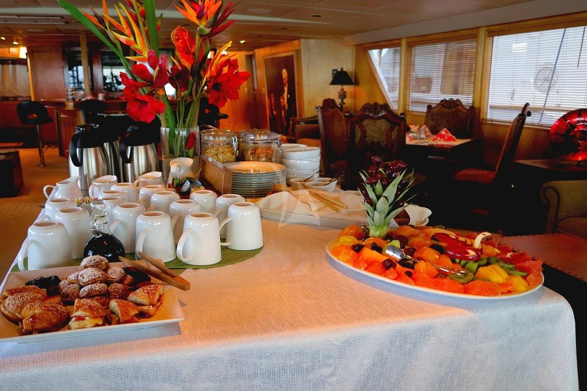 a table with food on it aboard LE MONTRACHET Yacht for Sale