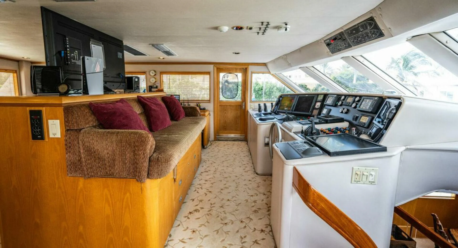 a living room with a couch and a laptop aboard LE MONTRACHET Yacht for Sale