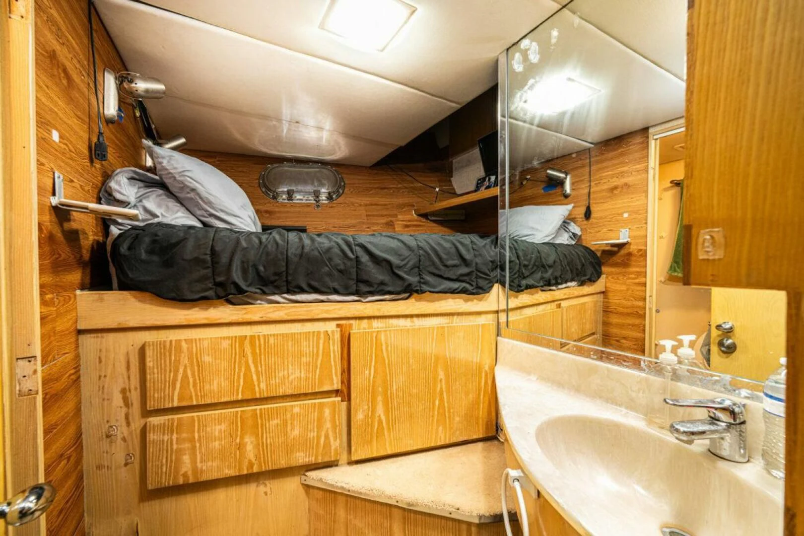 a bathroom with a sink and a mirror aboard LE MONTRACHET Yacht for Sale