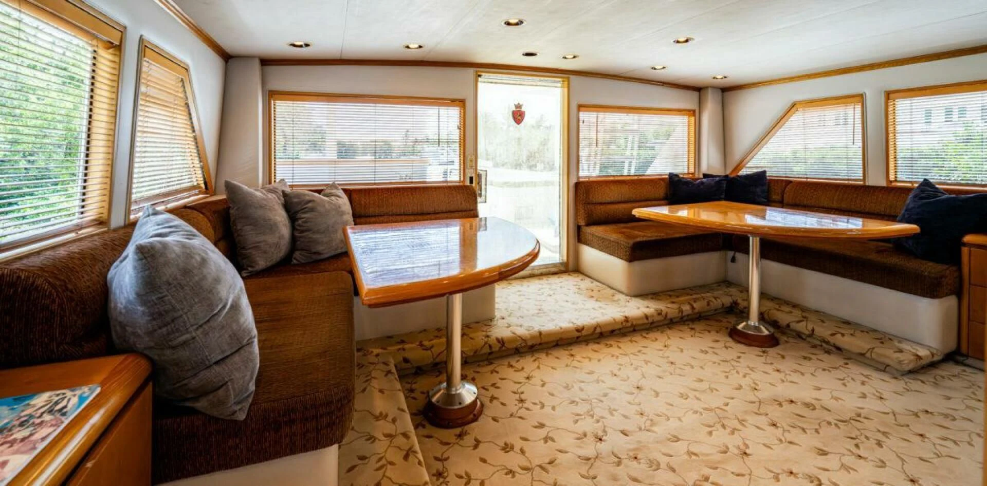 a living room with a couch and a coffee table aboard LE MONTRACHET Yacht for Sale