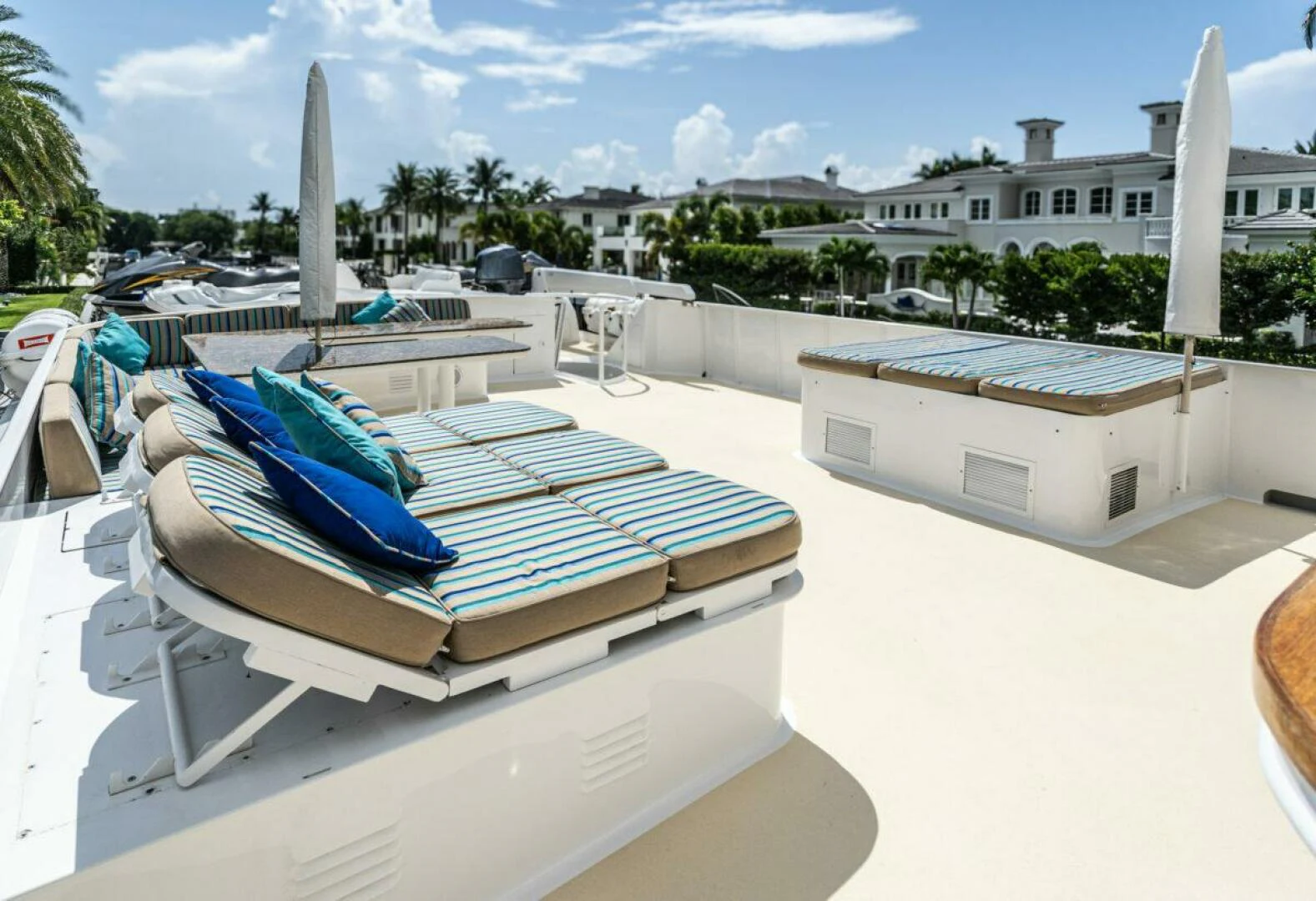 a pool with a building in the background aboard LE MONTRACHET Yacht for Sale