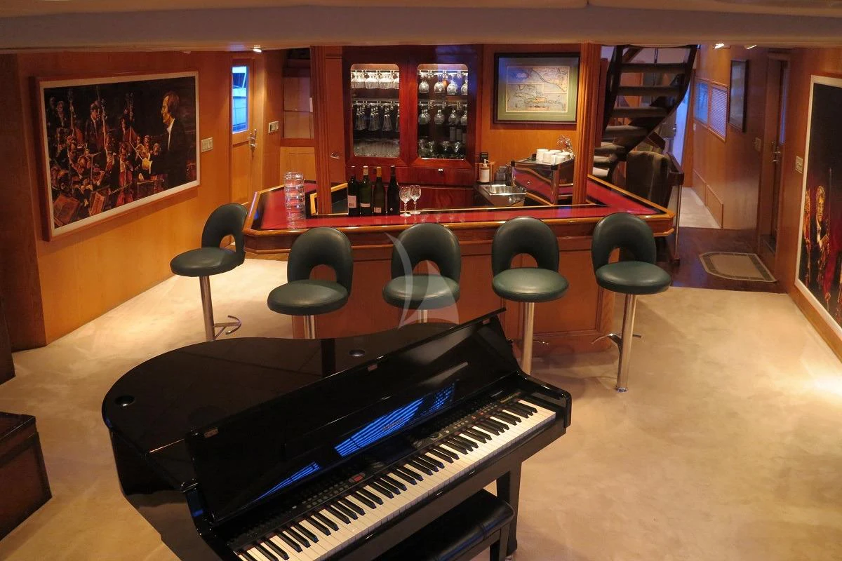 a bar with a table and chairs aboard LE MONTRACHET Yacht for Sale