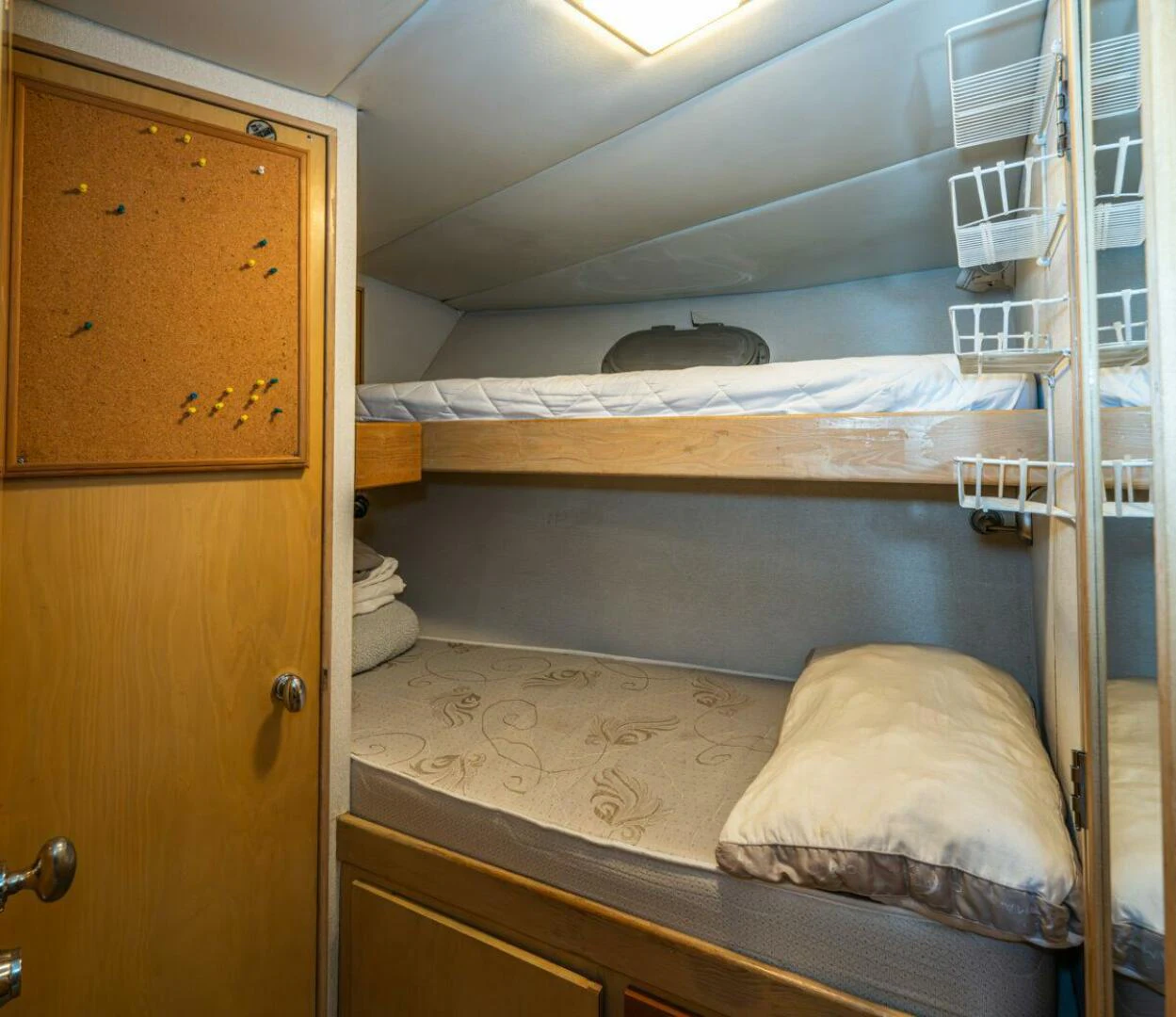 a room with a bed and a ladder aboard LE MONTRACHET Yacht for Sale
