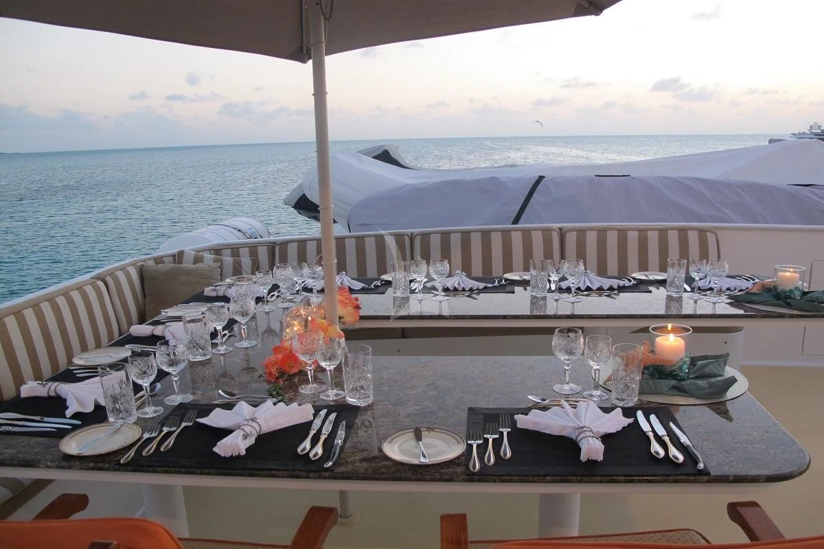 a table set for a dinner aboard LE MONTRACHET Yacht for Sale