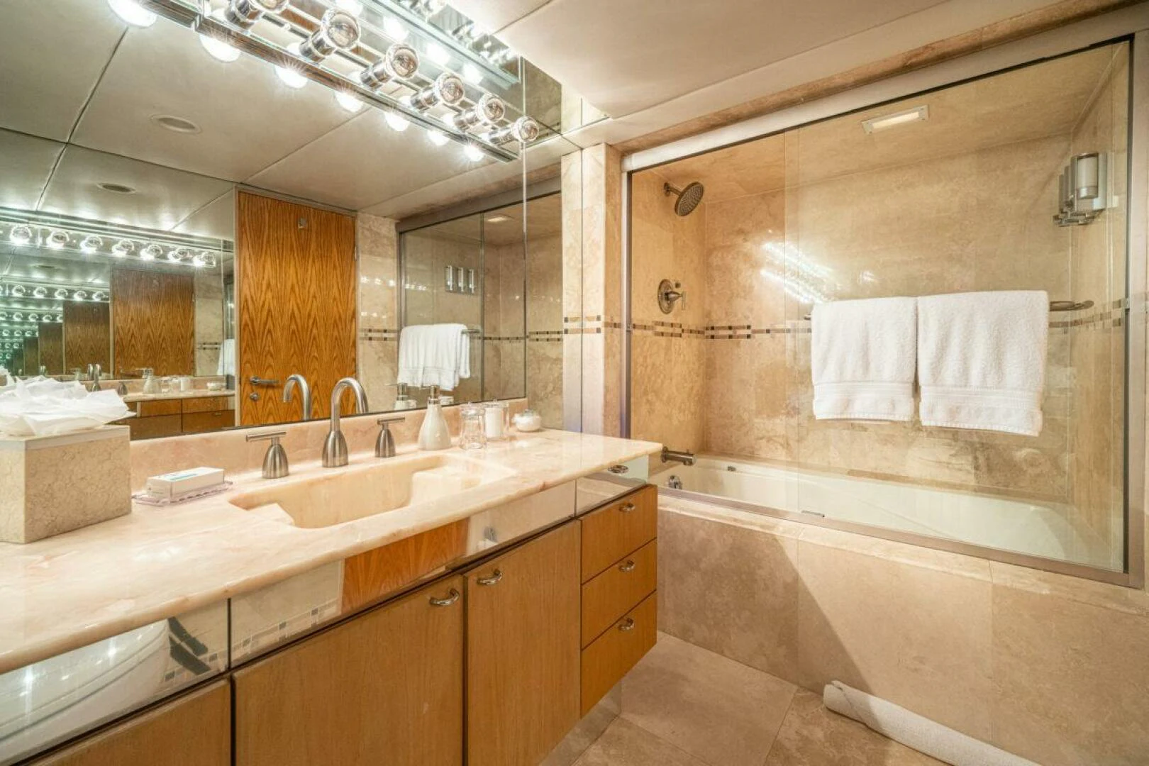 a bathroom with a large mirror aboard LE MONTRACHET Yacht for Sale