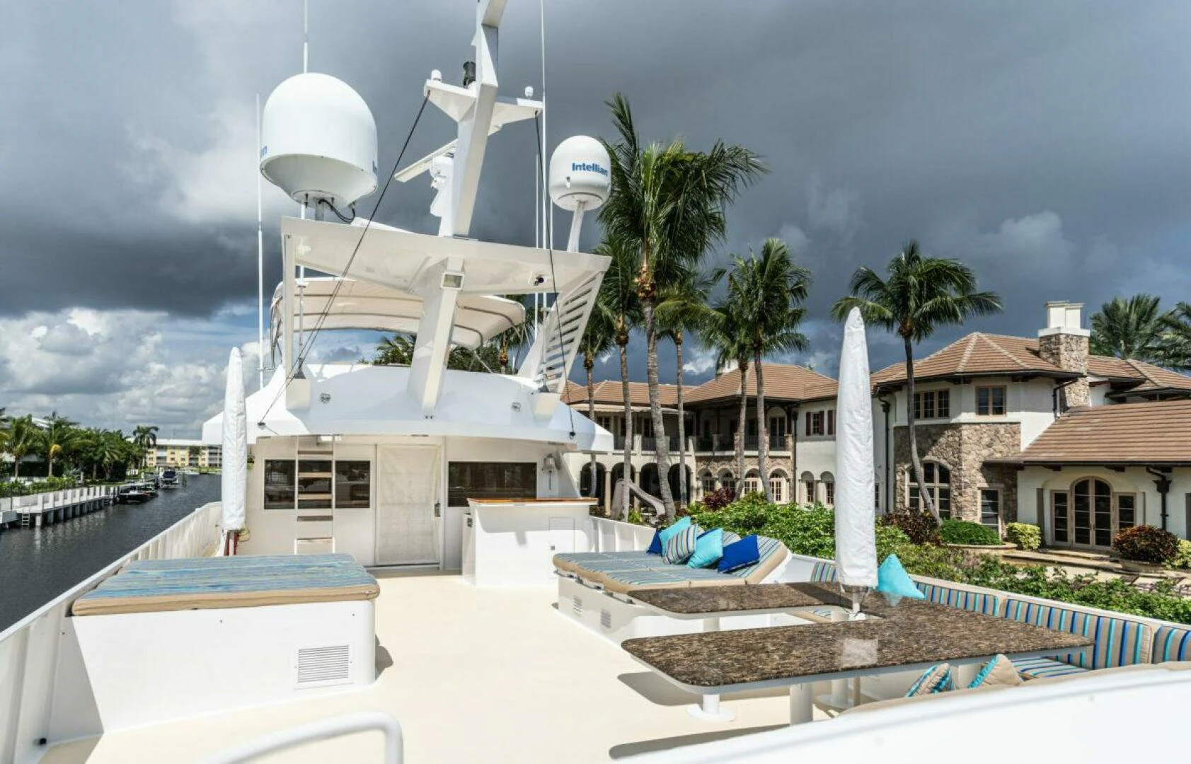 a white building with a white dome and palm trees and a white building with a white dome and aboard LE MONTRACHET Yacht for Sale
