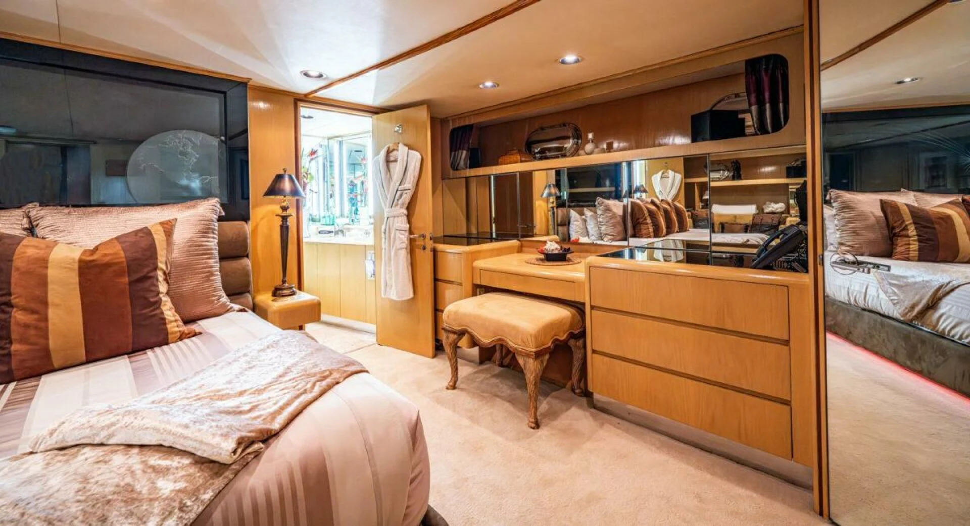 a bedroom with a bed and desk aboard LE MONTRACHET Yacht for Sale