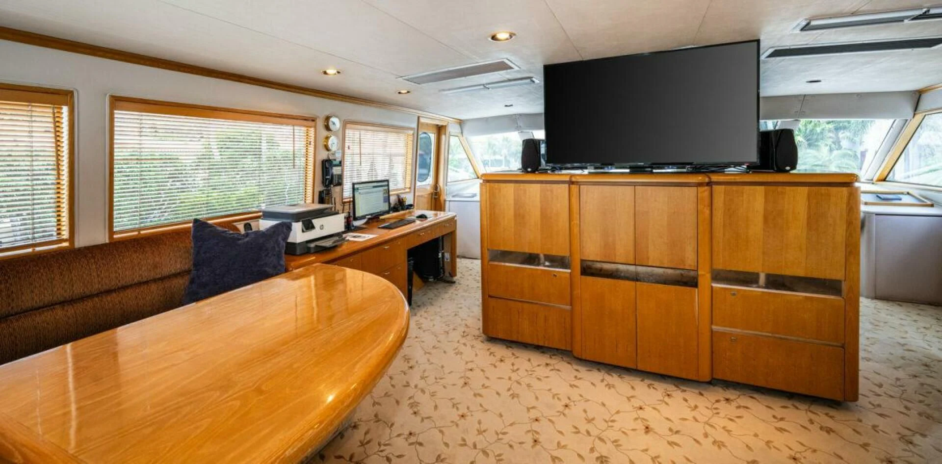 a room with a tv and a desk aboard LE MONTRACHET Yacht for Sale