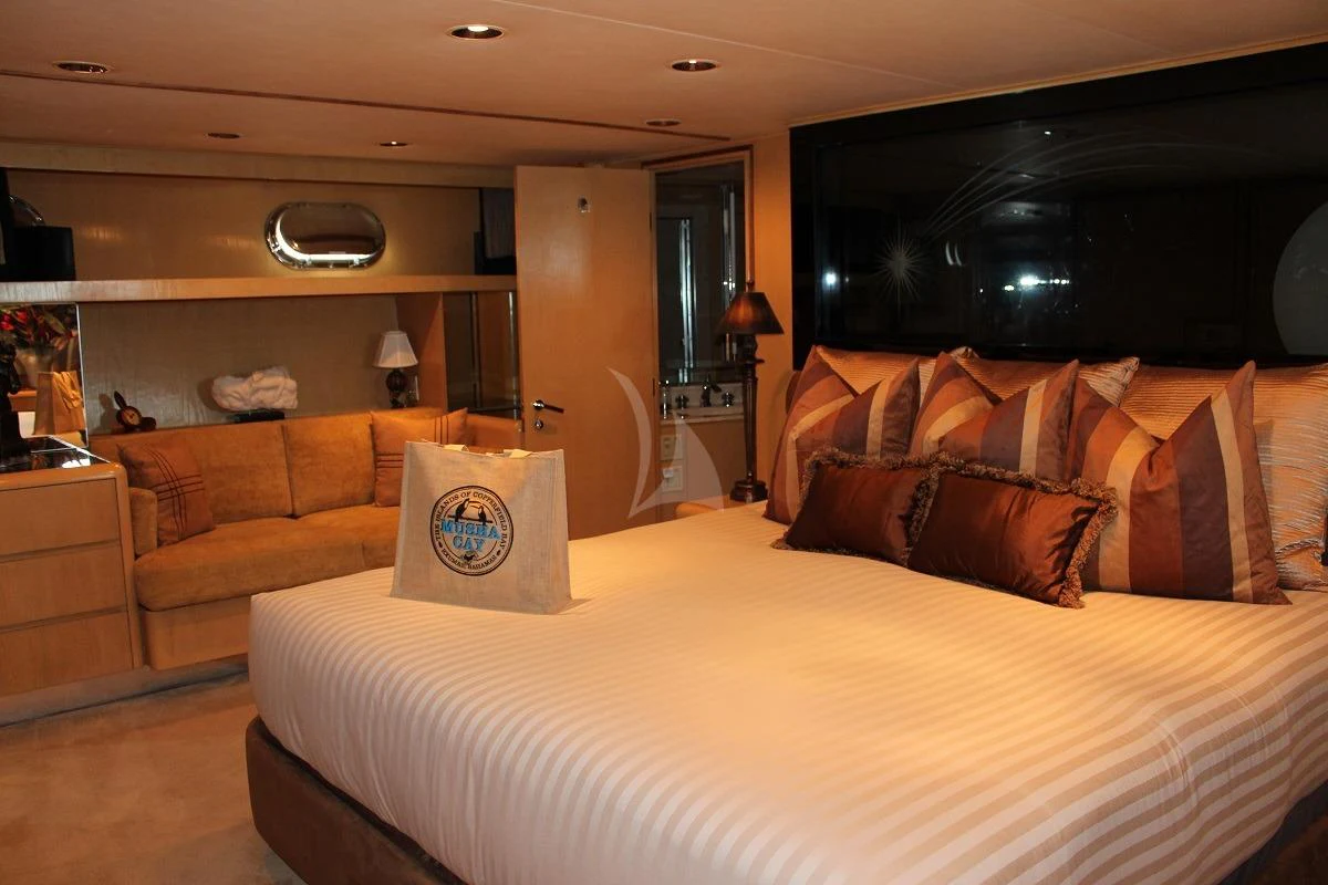 a bedroom with a bed and a couch aboard LE MONTRACHET Yacht for Sale