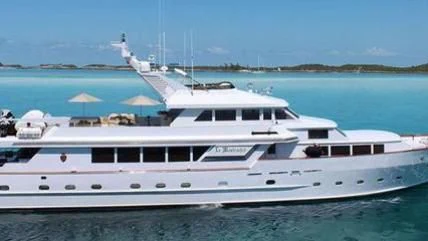 a white yacht on the water aboard LE MONTRACHET Yacht for Sale