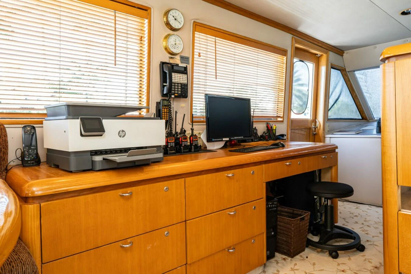 a desk with a computer and printer aboard LE MONTRACHET Yacht for Sale