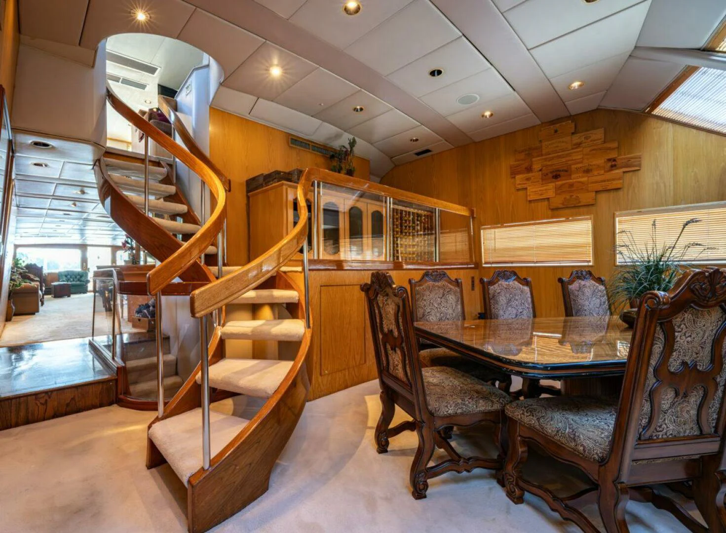 a dining room with a staircase aboard LE MONTRACHET Yacht for Sale