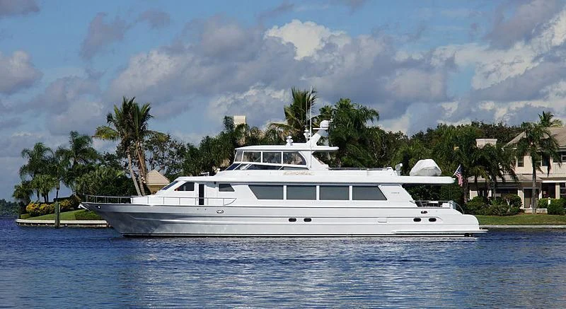 a white yacht on the water aboard POOR RICHARD Yacht for Sale