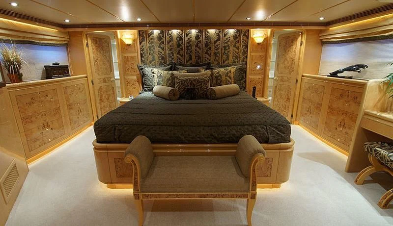 a large room with a bed and a dresser aboard POOR RICHARD Yacht for Sale