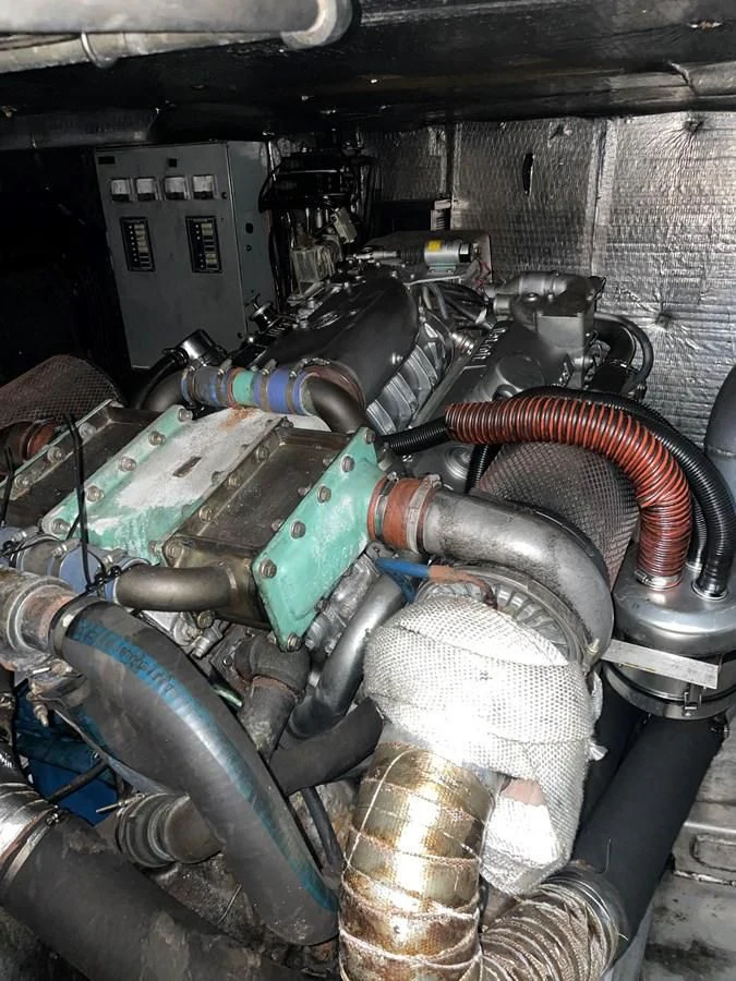 a car engine with a blue hood aboard MAGIC MOMENT Yacht for Sale