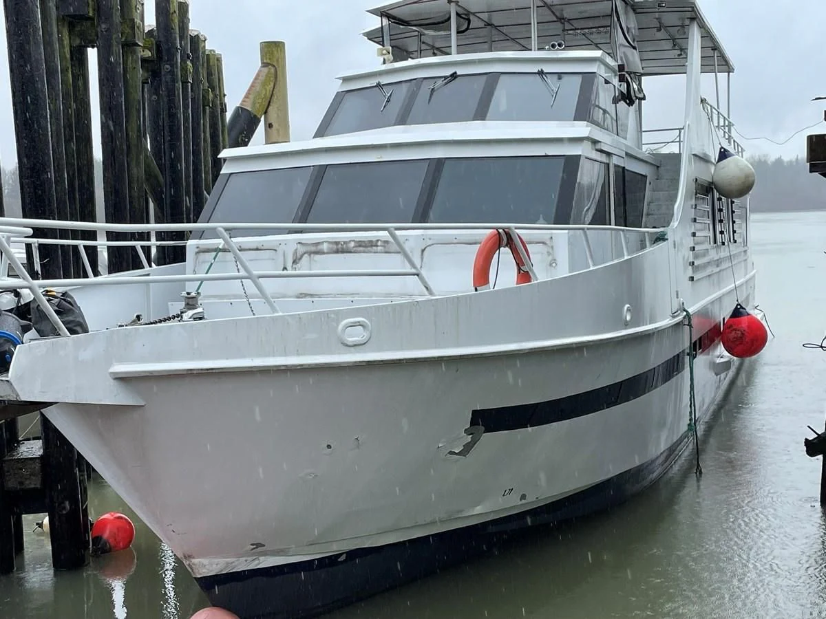 a white boat in the water aboard MAGIC MOMENT Yacht for Sale