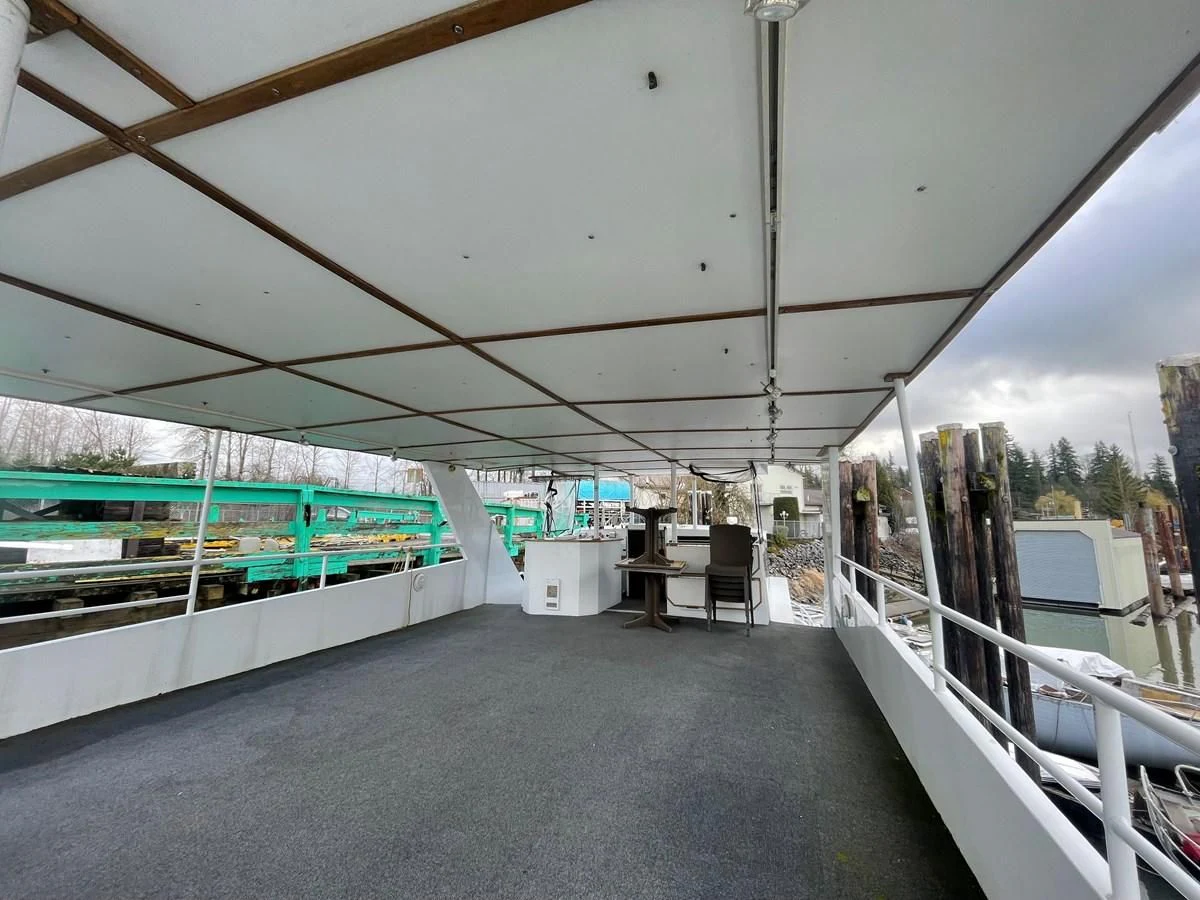 a large room with a large white awning and a large white object aboard MAGIC MOMENT Yacht for Sale