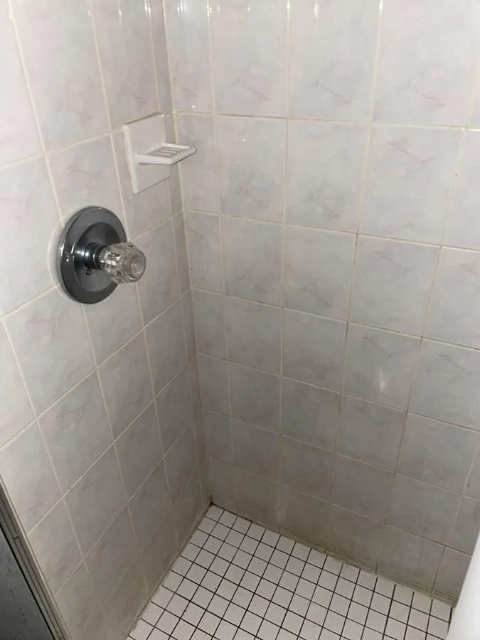a bathroom with a tile floor aboard MAGIC MOMENT Yacht for Sale