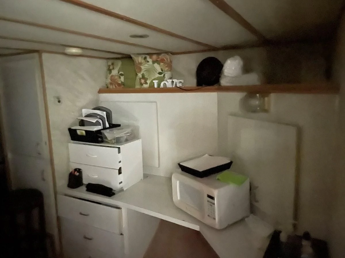 a white shelf with a white printer on it aboard MAGIC MOMENT Yacht for Sale