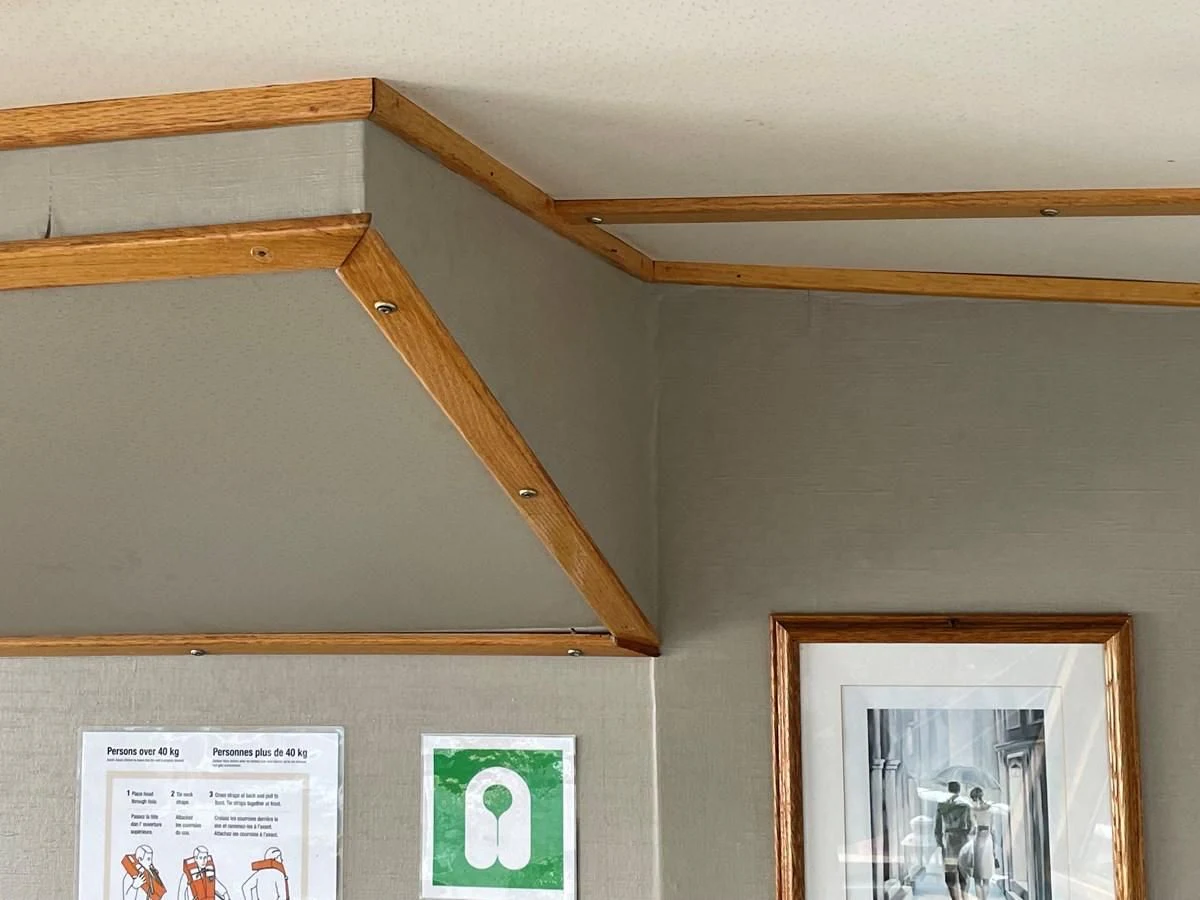 a wooden frame on a wall aboard MAGIC MOMENT Yacht for Sale
