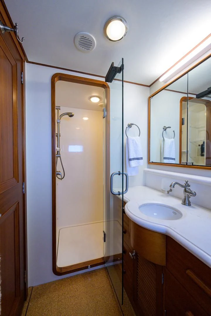 a bathroom with a shower unit and sink aboard SEA BOLD Yacht for Sale
