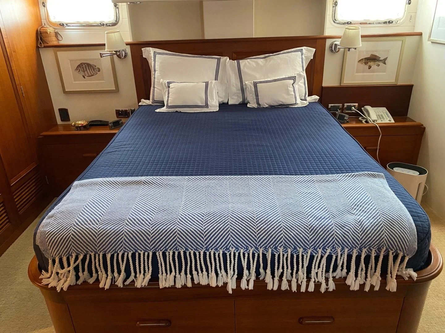 a bed with blue sheets aboard SEA BOLD Yacht for Sale