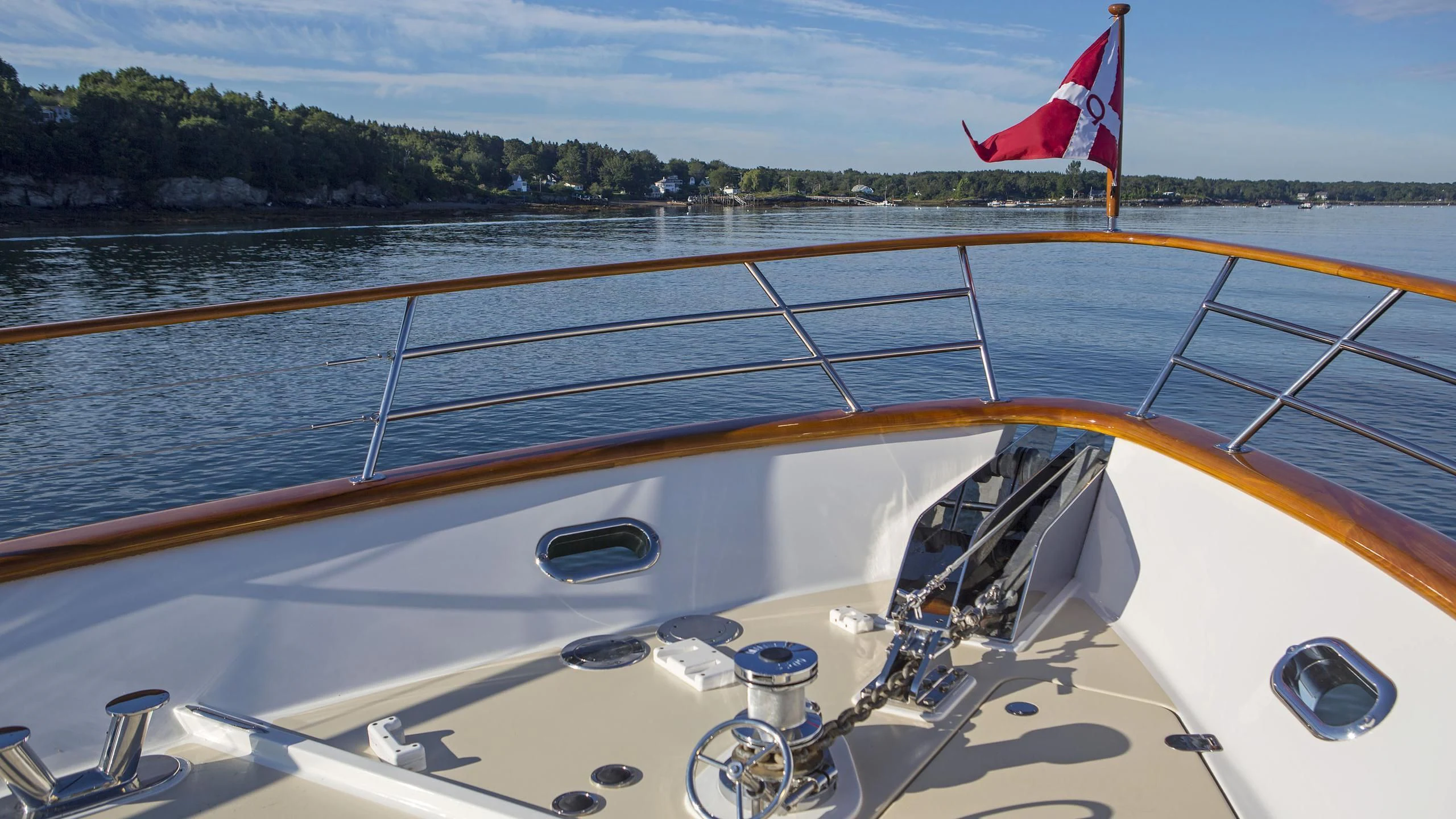 a boat with a flag on the front aboard SEA BOLD Yacht for Sale