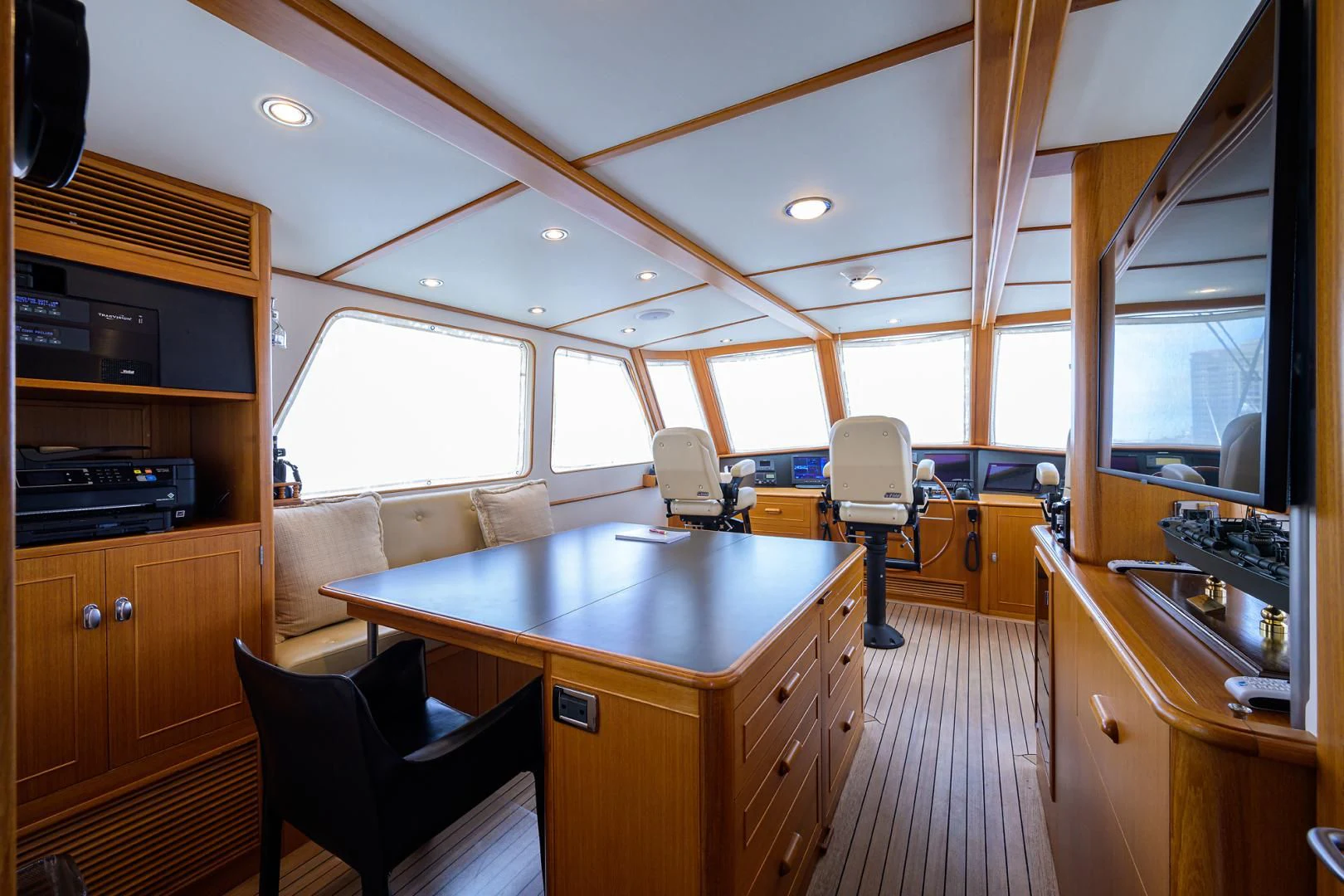 a kitchen with a table and chairs aboard SEA BOLD Yacht for Sale