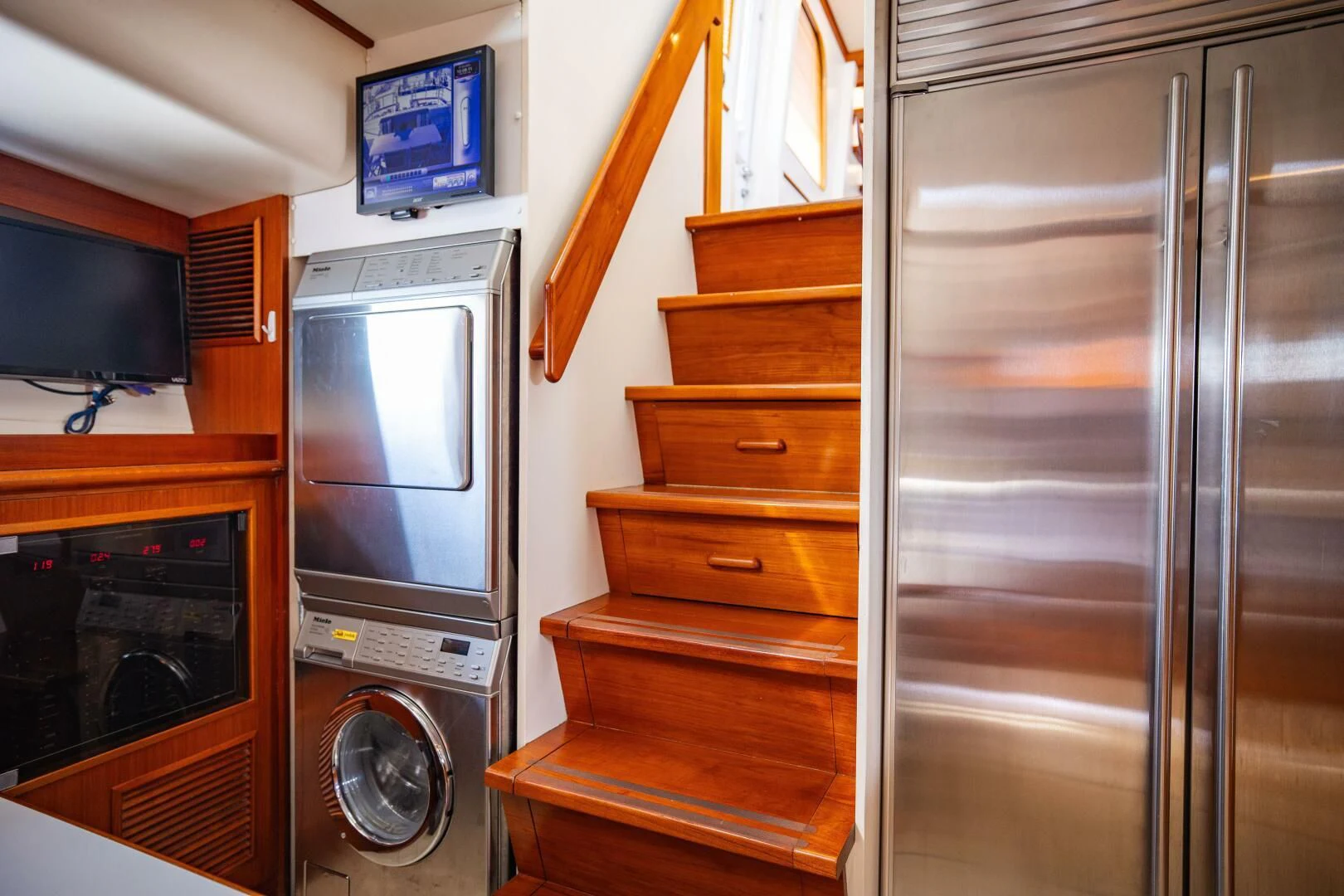 a kitchen with a large refrigerator aboard SEA BOLD Yacht for Sale