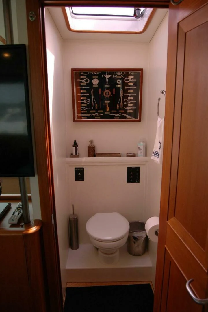a bathroom with a framed painting aboard SEA BOLD Yacht for Sale