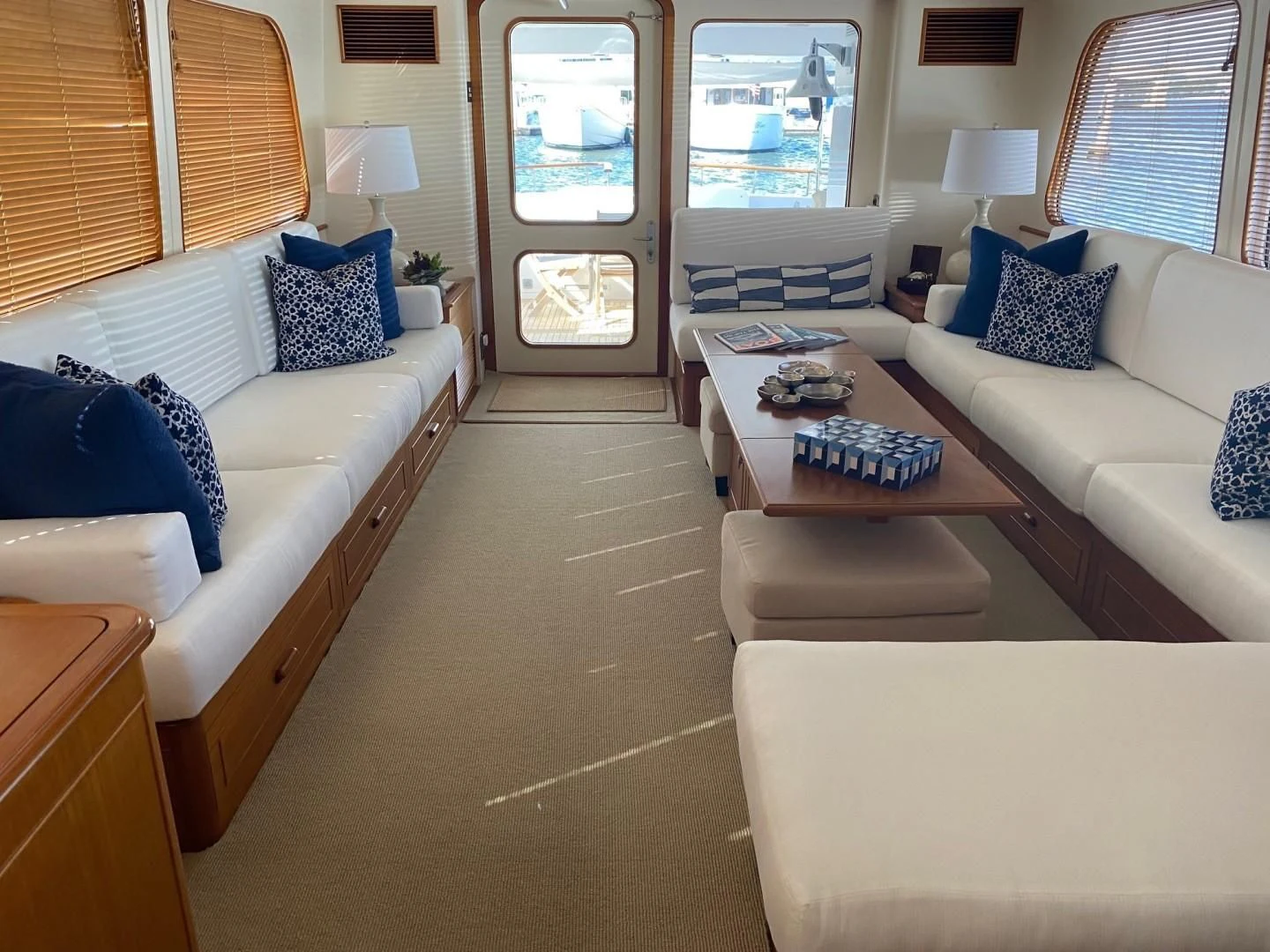 a living room with white couches aboard SEA BOLD Yacht for Sale