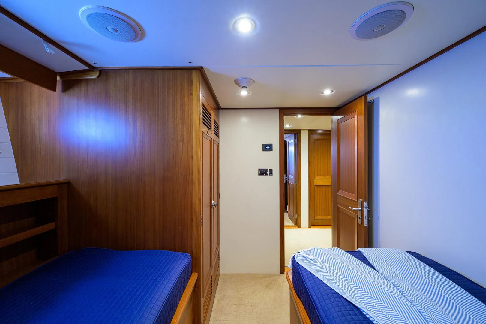 a bedroom with a bed and a closet aboard SEA BOLD Yacht for Sale
