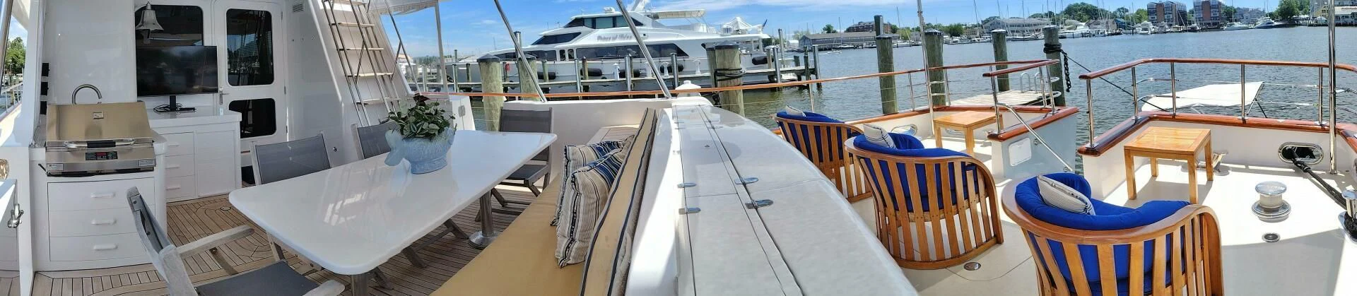 a deck with chairs and tables aboard SEA BOLD Yacht for Sale