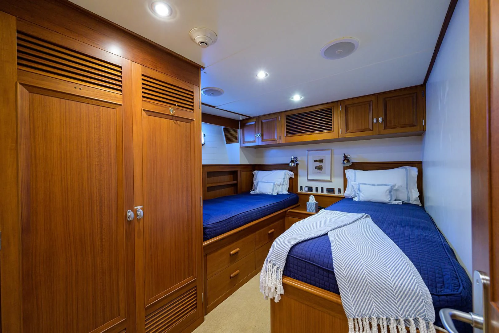 a bedroom with a bed and a closet aboard SEA BOLD Yacht for Sale