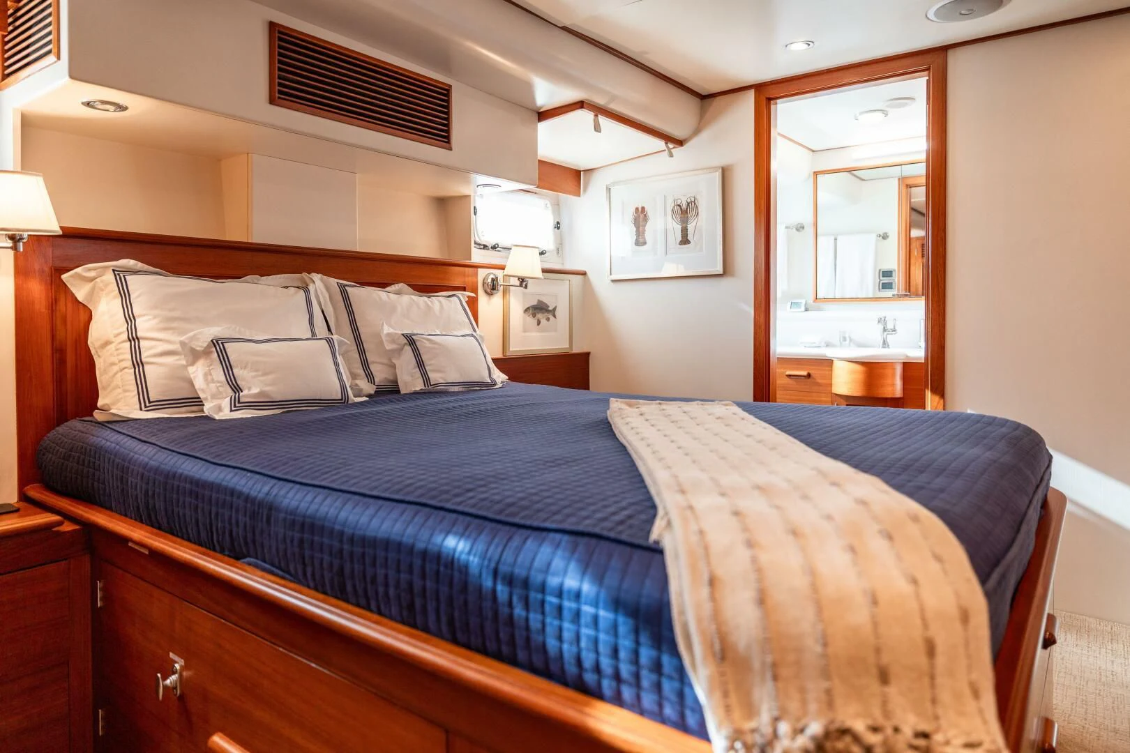 a bed with blue sheets aboard SEA BOLD Yacht for Sale