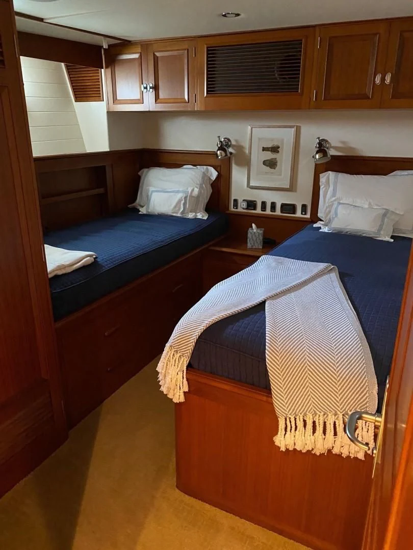 a room with a bed and a window aboard SEA BOLD Yacht for Sale
