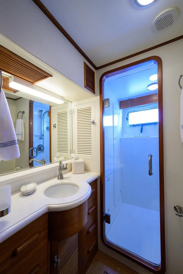 a bathroom with a blue door aboard SEA BOLD Yacht for Sale