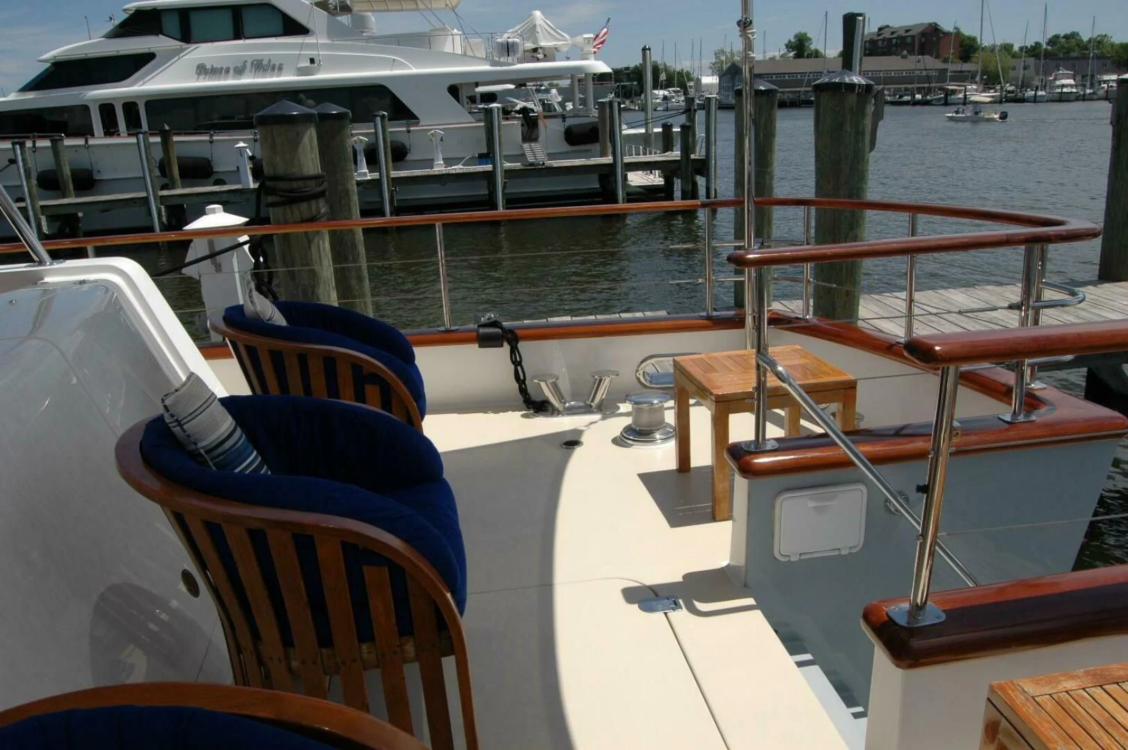 a boat dock with chairs and a table on it aboard SEA BOLD Yacht for Sale