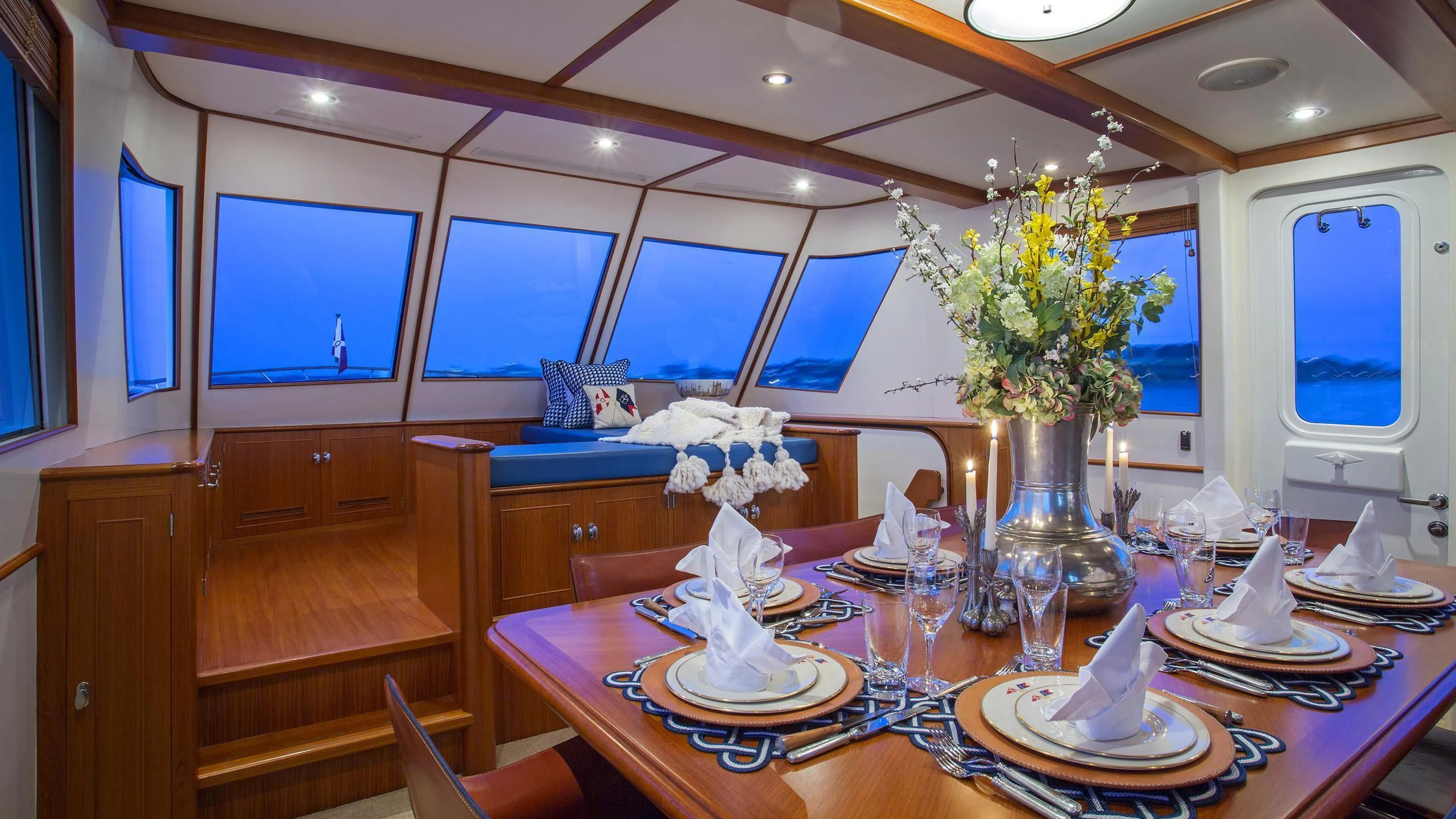 a table with a vase of flowers aboard SEA BOLD Yacht for Sale