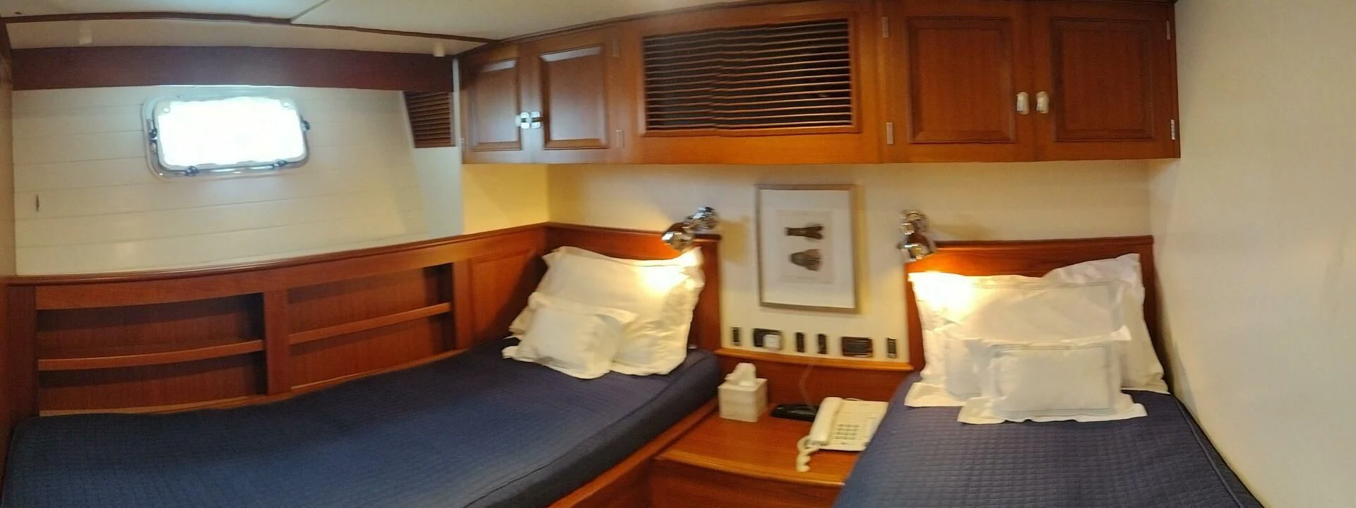 a room with a bed and a desk aboard SEA BOLD Yacht for Sale