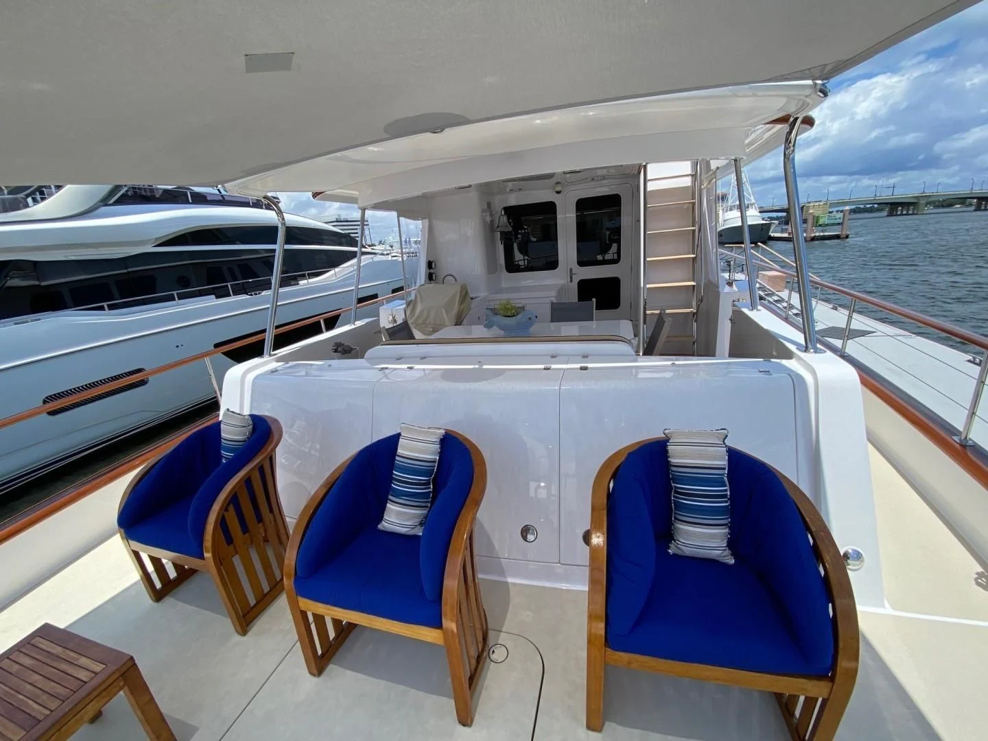 a deck with chairs and tables on it aboard SEA BOLD Yacht for Sale