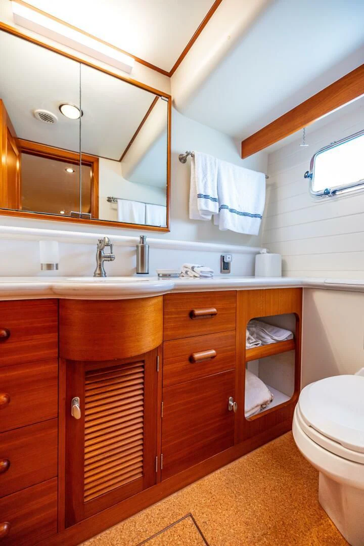 a bathroom with a sink and a mirror aboard SEA BOLD Yacht for Sale
