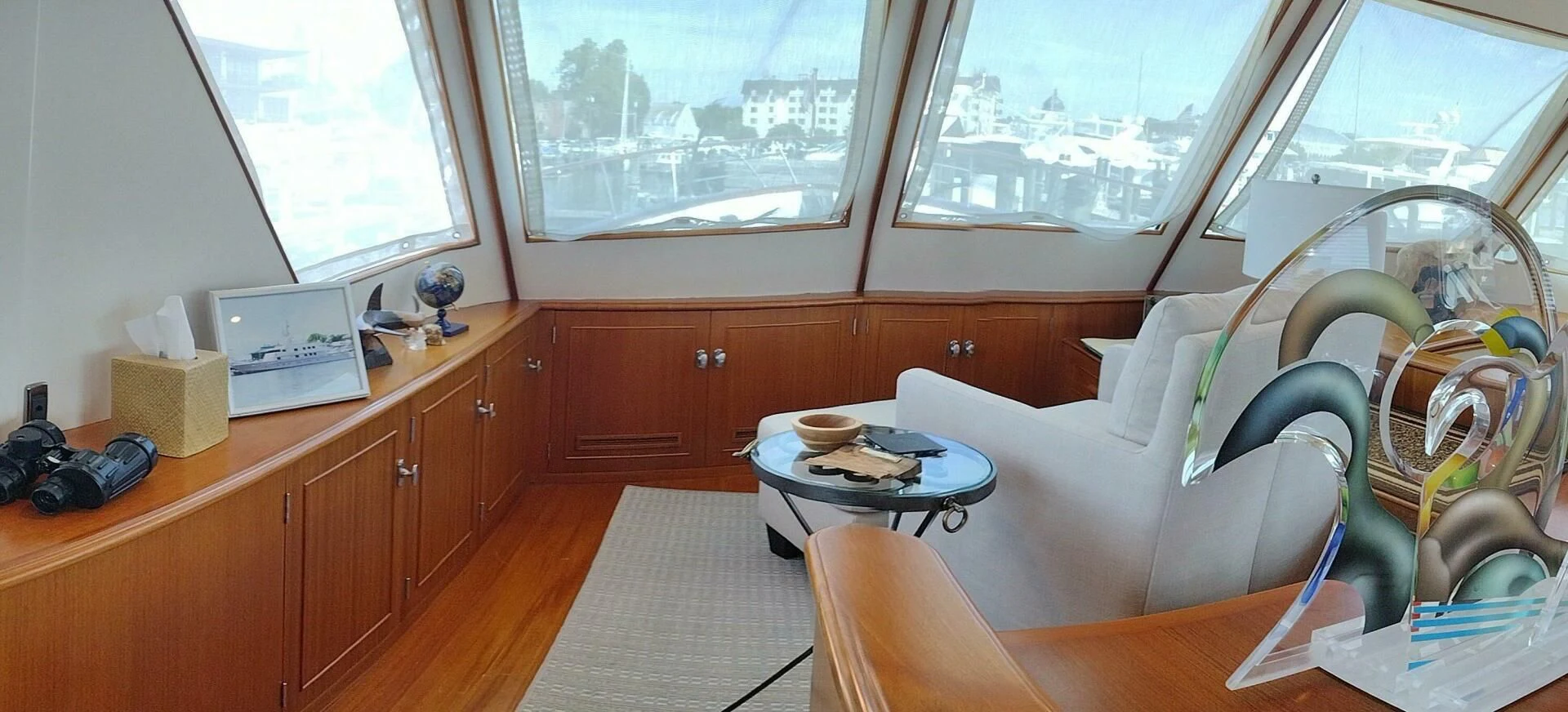 a room with a couch and a table with a laptop on it aboard SEA BOLD Yacht for Sale