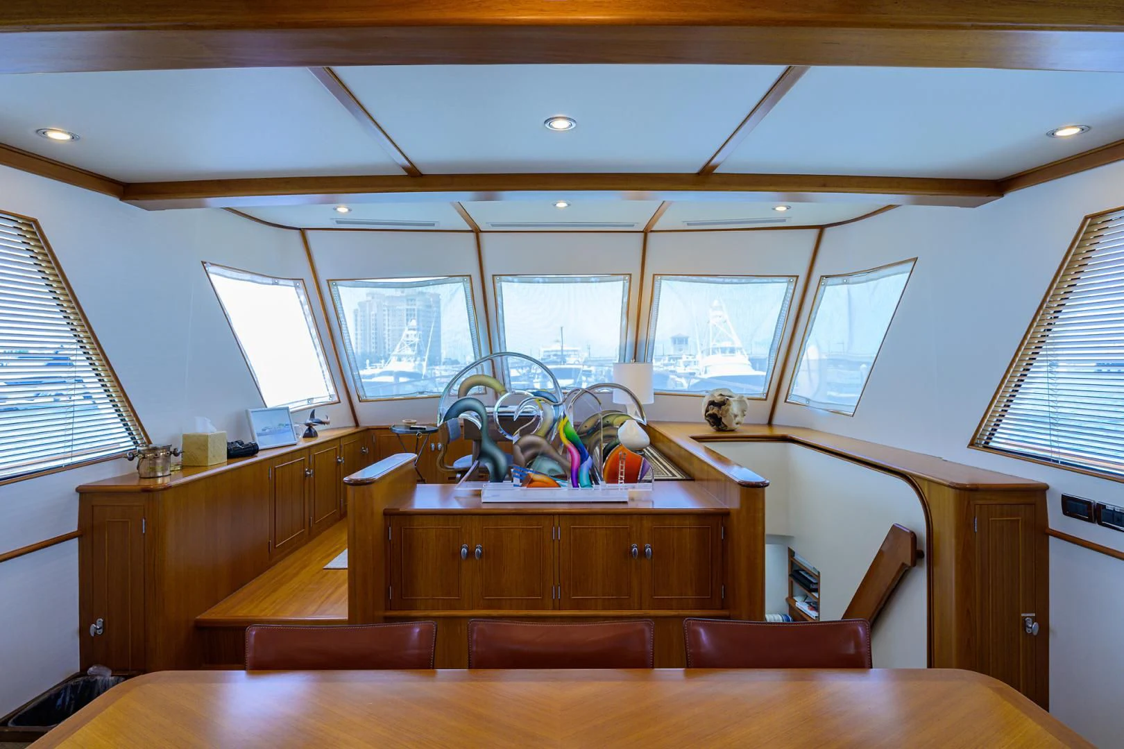 a room with a table and chairs aboard SEA BOLD Yacht for Sale