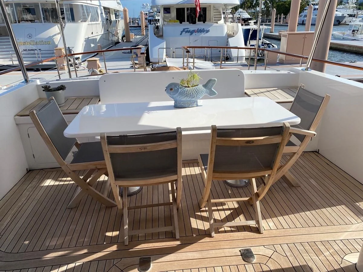 a table and chairs on a deck aboard SEA BOLD Yacht for Sale