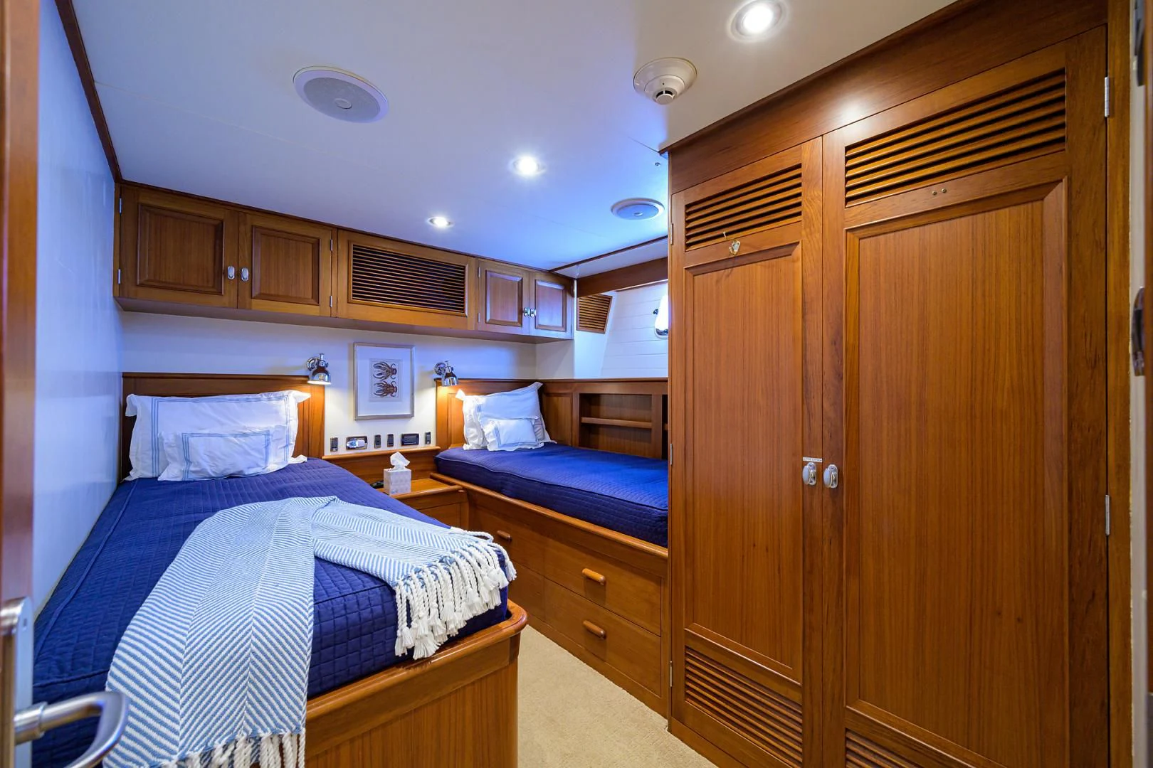 a bedroom with a bed and a closet aboard SEA BOLD Yacht for Sale
