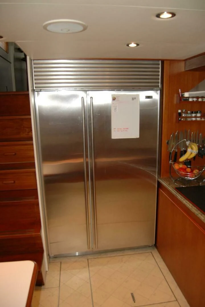 a stainless steel refrigerator in a kitchen aboard SEA BOLD Yacht for Sale