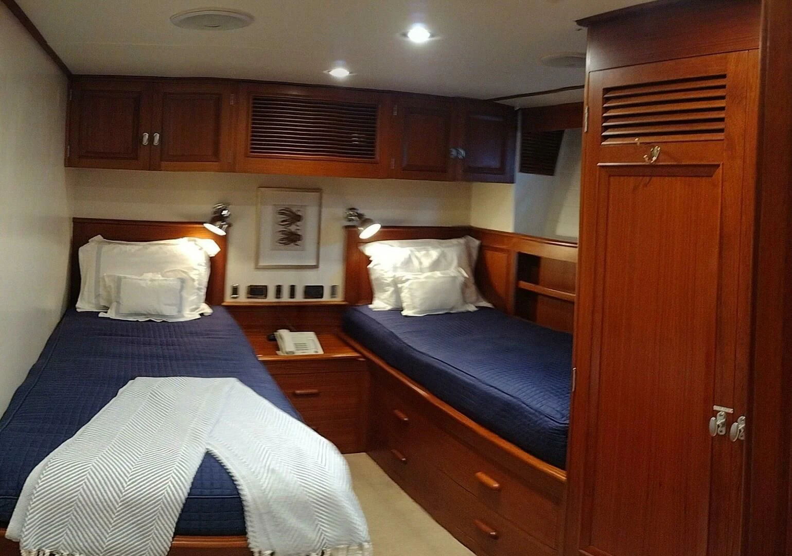 a bedroom with a bed and a dresser aboard SEA BOLD Yacht for Sale