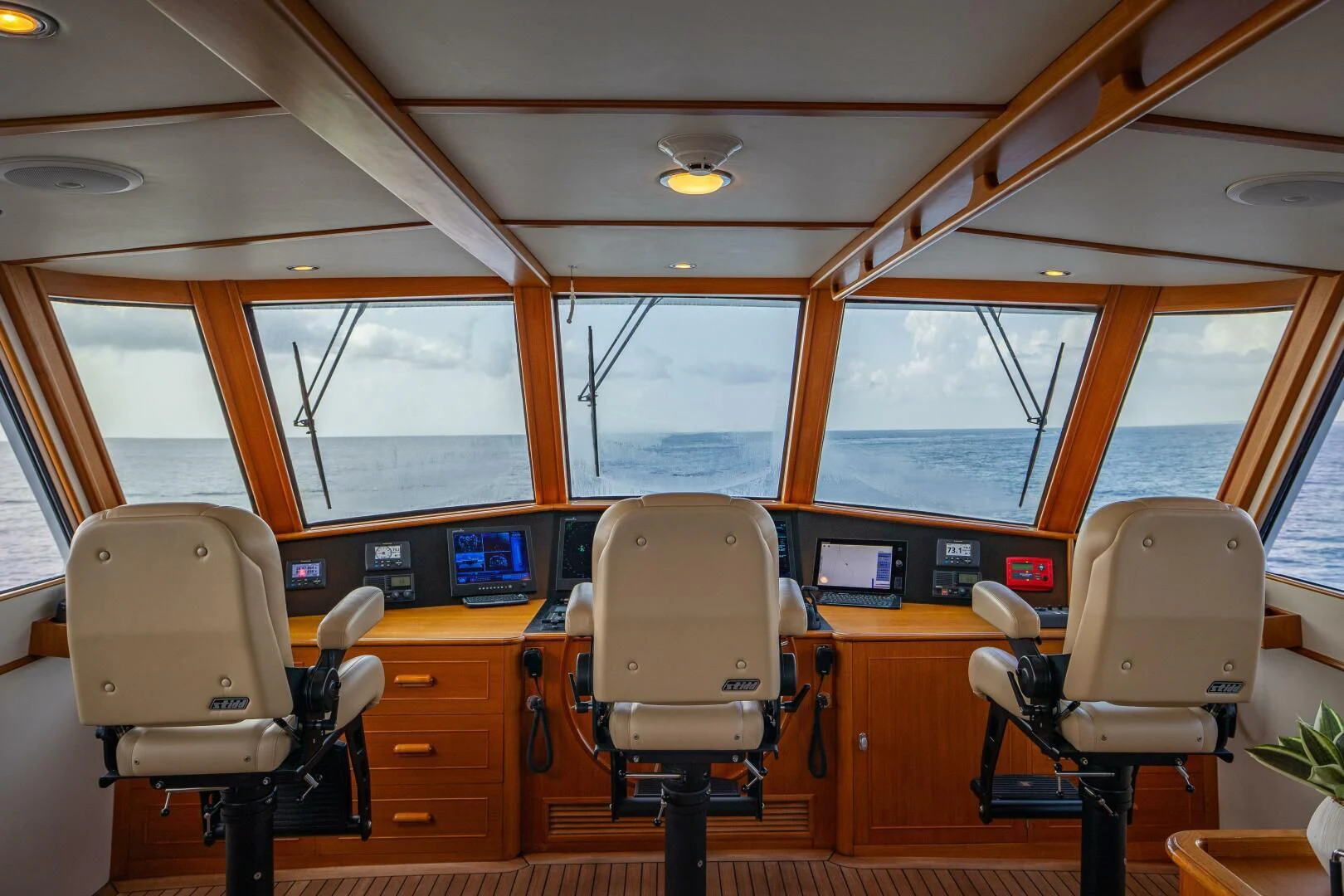 inside of a vehicle with chairs and desks and a large window aboard SEA BOLD Yacht for Sale